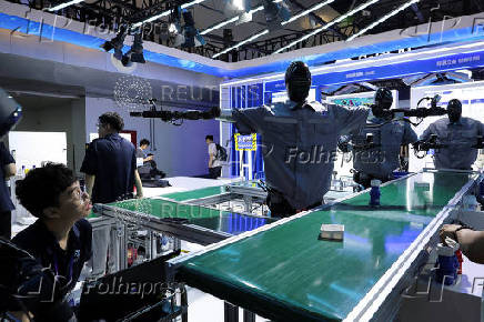Humanoid robots are displayed at the National and Local Co-Built Humanoid Robotics Innovation Center booth during WAIC in Shanghai