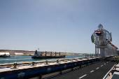 A ship moves through the Suez Canal, on the Excellence Day, in Ismalia