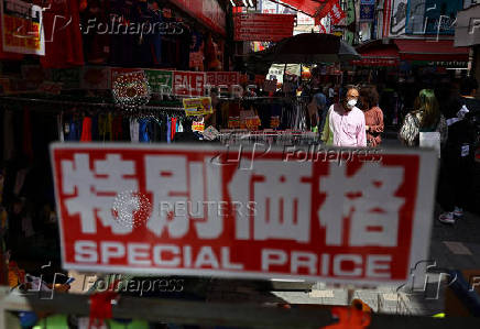 People make their way at Ameyoko shopping district in Tokyo