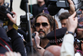 British actor and comedian Russell Brand appears at Westminster Magistrates' Court, in London