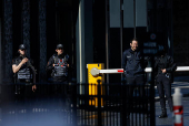 Police officers stand guard, near the Turkish Presidency's Dolmabahce working office, where Russia and Ukraine direct talks might happen, in Istanbul