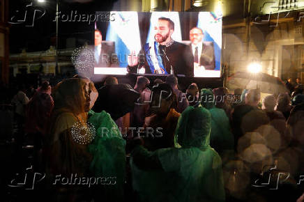 El Salvador's President Nayib Bukele delivers a speech to mark the first year of his second term in office, in San Salvador
