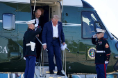 U.S. President Donald Trump disembarks Marine One at Morristown Airport