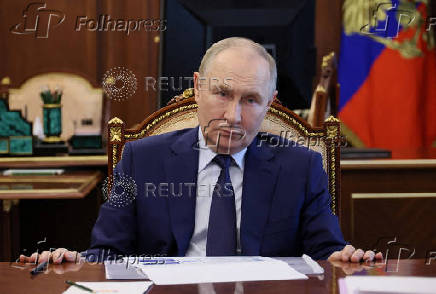 FILE PHOTO: FILE PHOTO: Russian President Vladimir Putin chairs a meeting on social issues, in Moscow