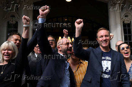 Former UBS and Citigroup trader Tom Hayes and former Barclays trader Carlo Palombo celebrate after their conviction for manipulating the LIBOR benchmark was overturned