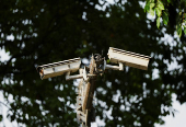Installed closed circuit television (CCTV) cameras are seen in a street in New Delhi