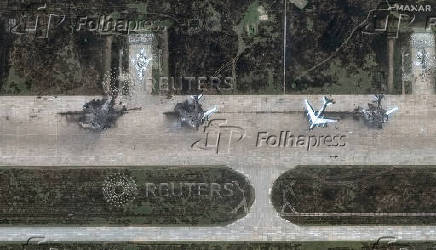 FILE PHOTO: A satellite image shows destroyed TU 95 aircrafts in the aftermath of a drone strike at the Belaya air base