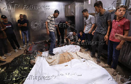 Funeral of Palestinians killed on Sunday by Israeli fire while seeking aid in northern Gaza, according to Gaza's health ministry, at Al-Shifa Hospital