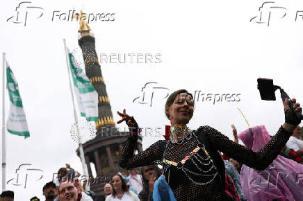Revellers attend the 'Rave The Planet' techno parade, in Berlin