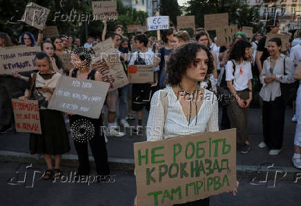 Ukrainians protest against a newly passed law, which curbs independence of anti-corruption institutions in Kyiv
