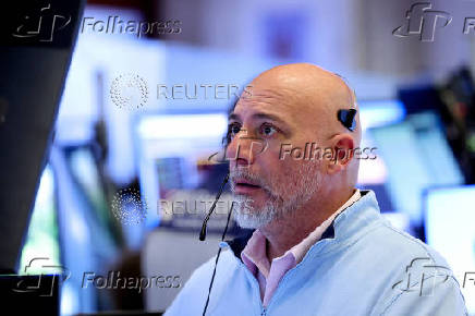 Traders work on the floor at the NYSE in New York City