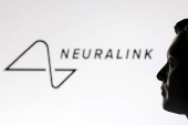 FILE PHOTO: Illustration shows 3D-printed miniature model of Elon Musk and Neuralink logo