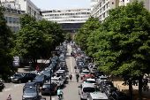 French taxi drivers protest near the Bercy Economy and Finance Ministry in Paris