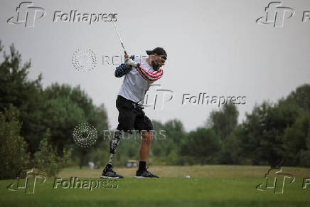 Ukrainian war veteran takes part in a golf tournament outside of Kyiv