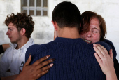A relative of Belgian national Seppe Lodewijckx reacts after a hearing in a case where Lodewijckx and another Belgian national David Lornoy pleaded guilty to illegal possession and trafficking of garden ants, in Nairobi