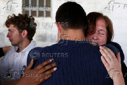 A relative of Belgian national Seppe Lodewijckx reacts after a hearing in a case where Lodewijckx and another Belgian national David Lornoy pleaded guilty to illegal possession and trafficking of garden ants, in Nairobi