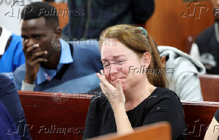 A relative of Belgian national Lornoy David reacts during a hearing in a case where David and another Belgian national Seppe Lodewijckx pleaded guilty to illegal possession and trafficking of garden ants, Nairobi