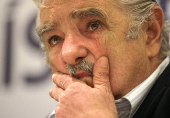 FILE PHOTO: Former guerrilla leader and Uruguay presidential candidate Jose Mujica gestures during a news conference in Montevideo