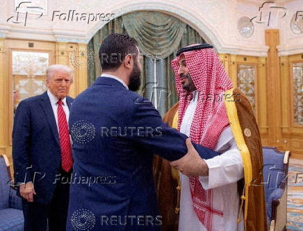 FILE PHOTO: Syrian President al-Sharaa meets with U.S. President Trump and Saudi Crown Prince Mohammed Bin Salman in Riyadh