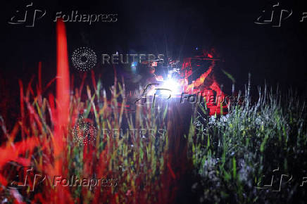 Policemen of the 'Khyzhak' Brigade prepare a Vampire combat drone for a fly in a front line in Donetsk region