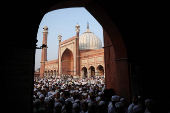 Muslims leave after offering prayers at Jama Masjid on the occasion of Eid al-Adha, in the old quarters of Delhi