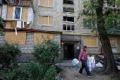 Apartment building damaged during Russian drone and missile strikes, in Kyiv