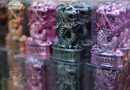 Merlion statues are displayed for sale at Chinatown in Singapore