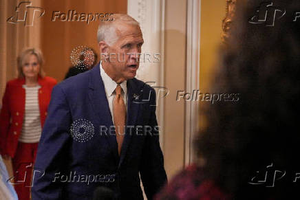 U.S. Senator Thom Tillis, (R-NC) walks to a policy luncheon meeting on Capitol Hill