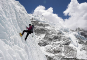 FILE PHOTO: A mountaineer holds on to the rope during an ice climbing session at Everest base camp