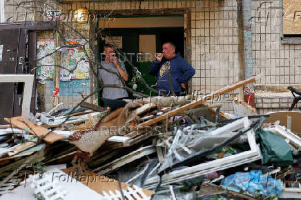 Apartment building damaged during Russian drone and missile strikes, in Kyiv