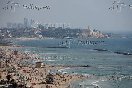 People spend time at the beach, in Tel Aviv