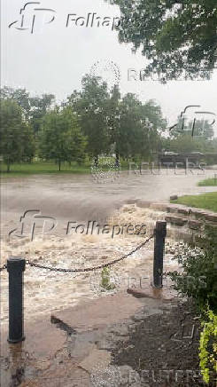 A view shows flooded creek, in Kansas City