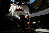 Worshippers gather for the celebrations for the Passion of the Lord at the Church of Saint Clement of Ohrid, on Good Friday, in Skopje