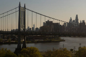 The Manhattan skyline is seen behind the Robert F. Kennedy Bridge in New York