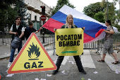 Activists of Greenpeace attend a protest near the Russian Embassy in Paris