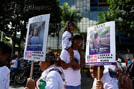 Demonstrators march to demand the return of Venezuelan migrant children after their parents were deported from the U.S., in Caracas