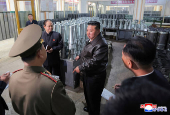 North Korea's leader Kim Jong Un visits a factory that makes shells and machinery