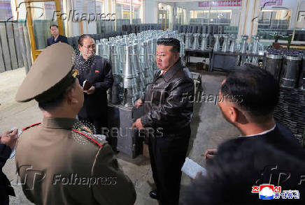 North Korea's leader Kim Jong Un visits a factory that makes shells and machinery
