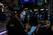 A trader works on the floor at the New York Stock Exchange (NYSE) in New York City