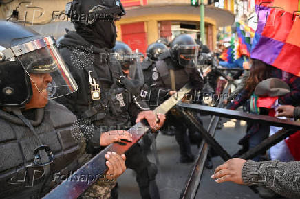 Supporters of Evo Morales's candidacy clash with police, in La Paz