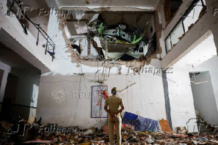 FILE PHOTO: Wreckage of the Air India plane after it crashed on take-off from Ahmedabad, India