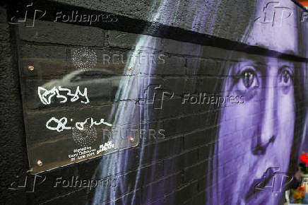 Fans pay tribute following the death of Ozzy Osbourne, in Birmingham