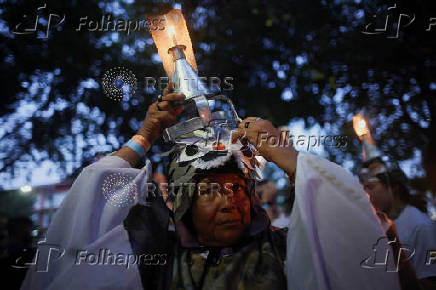 Demonstrators attend a march in defense of the living forest, territorial rights, and global climate responsibility during the U.N. Climate Change Conference (COP30) in Belem