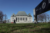 A pedestrian walks near the Supreme Court of Canada in Ottawa