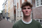 Harvard student Alfred Williamson, who comes from Wales, stands in a street in Copenhagen