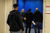 A Haitian migrant is detained by U.S. Immigration and Customs Enforcement agents at US Immigration Court in New York City