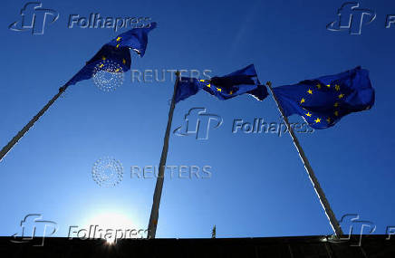 FILE PHOTO: European Union flags flutter outside the EU Commission headquarters in Brussels