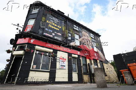 A mural honouring Diogo Jota appears in Liverpool