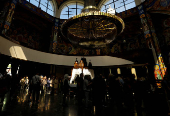 Worshippers gather for the celebrations for the Passion of the Lord at the Church of Saint Clement of Ohrid, on Good Friday, in Skopje