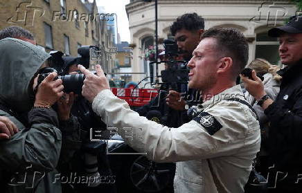Political activist Tommy Robinson faces court over journalist harassment